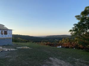 Million dollar view of river valley! This home features 4 bedrooms 3 bath thats 2450 heated. Living room has vaulted ceilings and 10 ft through out open floor plan,,custom cabinets,walk in shower in master bath, luxury flooring,All you could ask for and more.