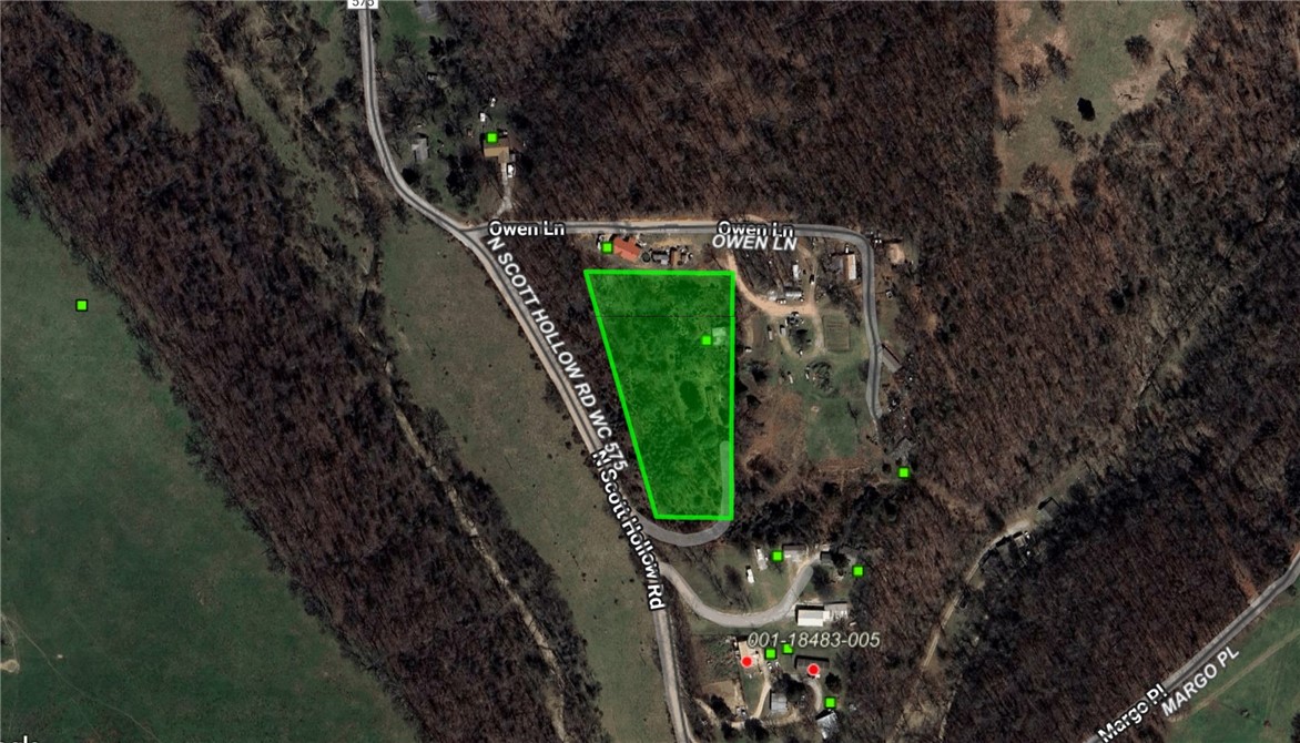 Imagine building your dream home atop your very own Ozark hill—this exceptional, unrestricted 2.69-acre parcel offers sweeping panoramic views and is just minutes from town. Utilities are nearby, and a septic permit is in place, providing essential groundwork for your vision. Currently, a mobile home resides on the property and conveys with the land; pricing reflects land value only. An easement for accessing the property is actively being negotiated, ensuring reliable entry while minimizing future logistical concerns. Please DO NOT access the property from the neighbors—enter only via Scott Hollow Rd. This rare opportunity combines the tranquility of rural living with thoughtful planning—your perfect canvas to bring your Ozark dream to life in one idyllic, accessible parcel.