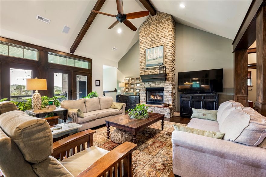 Incredible views in all seasons! Live close to Coler Park, have easy access to I-49, but enjoy complete privacy. Craftsman style home with custom features, including office with bookcase built ins, beams and wall feature trims, & an incredible shop/garage space for all your toys. Storage is no problem here! Media room will include projector & screen. Deck has textured concrete floor. Don't miss this quality, one owner  home on .65 acre!  Agent Owned