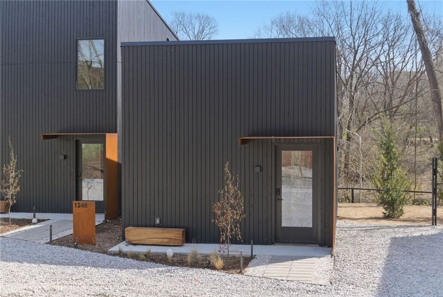 Modern creekside cabins just 1 mile from Bentonville Square! Perfect for investors, corporate buyers, or
young professionals seeking downtown access with the ability to offset cost of living. Each parcel includes
2 dwellings (6 total across 3 lots / 0.58 acres) backing up to Black Apple Creek with waterfall and trail
views. R-2 zoning with new sewer and utilities, shared access drive. Suite 1: 376 SF studio 1 bath. Suite 2:  892 SF 2 bed 1.5 bath. High-end finishes include cedar rainscreen, concrete floors, stainless appliances, and high-efficiency cassette mini-splits. Buy one parcel or all three at a portfolio discount. Buyer to verify all details.