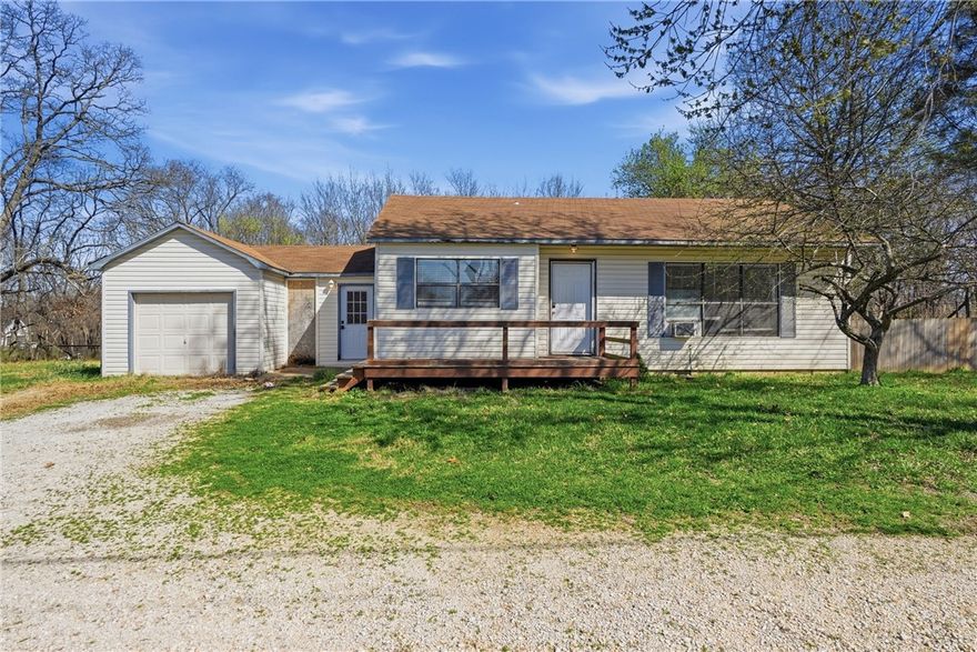 Charming hobby farm on 1.30 acres in a prime Pea Ridge location! This cute & cozy property is just ½ mile from Pea Ridge Schools & directly across from Pea Ridge City Park, offering the perfect mix of convenience & country living. The home features 2 bedrooms, 1 updated bathroom, a large living room, & an eat-in kitchen. The kitchen includes granite countertops & a classic white subway tile backsplash, while laminate & vinyl wood-plank style flooring run throughout the home for a clean, modern feel.
Outside, you’ll love the flat 1.30 acres that are fully fenced, ideal for a hobby farm or anyone wanting space for animals. A shed tucked under the trees provides extra storage & adds to the charm of the property. This is a great starter home with land, space, & a fantastic location. Additional opportunity: An adjoining 1.05-acre lot is also listed for sale, offering even more possibilities for expansion, animals, or future building. Don’t miss seeing this one!