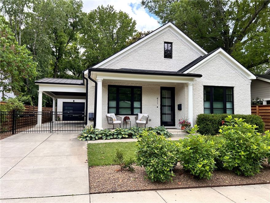 Rare opportunity in the desirable Washington-Willow Historic District—this 2020-built bungalow blends timeless charm with modern comfort. The home features an all-brick exterior, metal roof, covered front porch, and 2-car tandem garage with backyard access. Enjoy a powered driveway gate, large screened-in porch, and additional concrete patio. Inside offers engineered hardwood floors, high ceilings, and abundant natural light with powered blinds throughout. The kitchen includes a touch faucet and wall-mounted coffee bar faucet. Both baths feature tiled showers and Washlet toilets. Wired for electric car charging, hot tub, Sonos sound (master, dining, kitchen), and security system with DVR and 3 exterior cameras. Includes freestanding wood-burning stove and recirculating hot water. Ideally located near the Razorback Greenway, shopping, dining, and the U of A—this home delivers style, comfort, and convenience in one of Fayetteville’s most beloved neighborhoods.