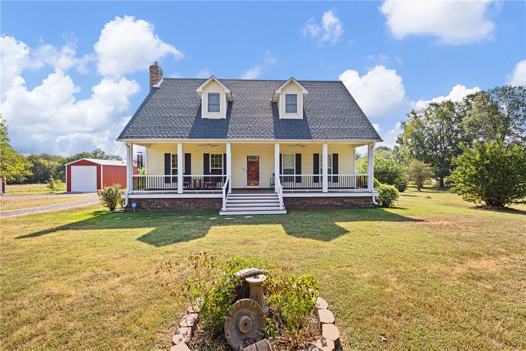 Located at the end of a quiet dead-end country lane, this one-owner home sits on 2.36 peaceful acres filled with hardwood trees, flowering bushes, and beautiful landscaping. Built in 2005, the home offers 3,242 sq ft with 5 bedrooms, 3 full baths, hardwood and tile flooring, custom oak cabinetry, granite countertops, and a cozy soapstone wood stove. Enjoy Trex decking front and back, two HVAC units, and a durable architectural roof. Outside features include a three-bay tractor shop and a 40-foot RV shop, both fully enclosed with electric and concrete floors, as well as a large chicken coop, feed area, and woodshed. Chickens, guineas, and ducks convey. A perfect mix of comfort, space, and country charm