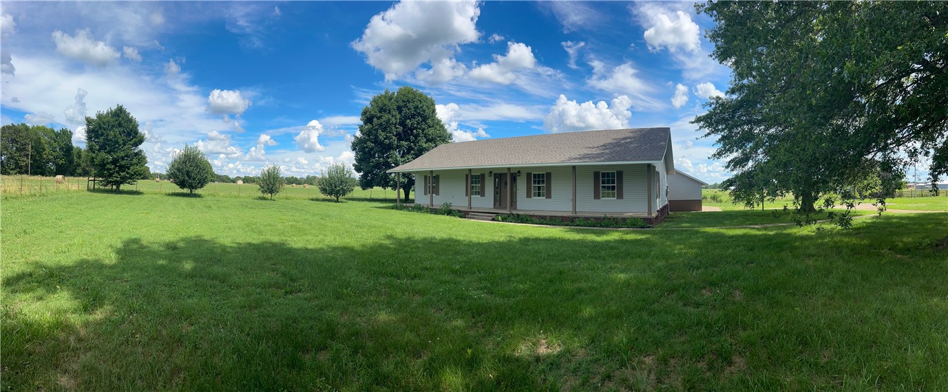 Are you looking for country living minutes away from town & minutes away from the interstate? This home & 2+/- acres is for you! Completely remolded. New roof! New kitchen cabinets & granite counter tops! New HVAC! New bathroom remodel! New flooring. New paint. Needless to say this home is like new & ready to move into! The beautiful new kitchen looks into your big back yard & beyond that is a serene cattle farm and hay field. The large living area is perfect for entertaining or just relaxing at home. The master suite features ample room, large walk in closet, and beautiful newly remodeled bath. The huge front porch that runs the entire length of the house is perfect for relaxing, & the back deck is perfect for your next backyard BBQ! This package deal also includes a spacious detached 2 car garage, & old lofted barn. This place really does have it all! Perfect location. Full of country charm but with all the modern amenities! It even has space for some small livestock! Out of City Limits! Huge pantry and laundry!