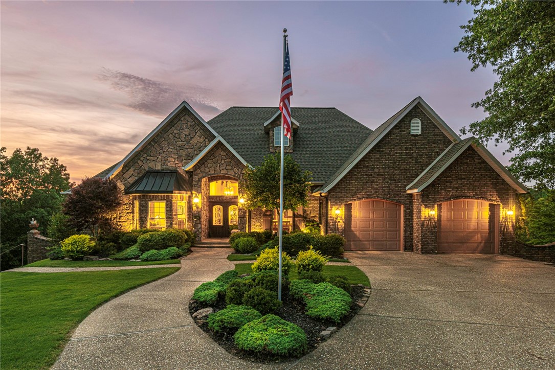 LUXURIOUS HOME! This immaculate 5 bedrooms 3.5 home is minutes away from Beaver Lake, Parks, & downtown Rogers! Main level of this home enjoys a family room w/ wood floors, 13ā tall ceilings, accent beams, & wall-to-wall windows for natural light. A gourmet kitchen w/ lots of storage, granite, island, peninsula, gas double oven, gas range. Off the kitchen, a 2nd living rm w/ natural light & fireplace! PLUS Formal dining! Relax in the main floor primary bedroom w/ wood floors, deck access, fireplace, & private ensuite feat: double sink, shower, jacuzzi, & makeup vanity. + main floor office/2nd bedroom! Downstairs enjoy a third living space, a mother-in-law suite w/ kitchenette (refrigerator incl.), as well as a 2nd primary bedroom w/ private bathroom! Gorgeous lower deck & upper deck to enjoy! BONUS: New roof in 2019, in-ground generator, railing/cement walkway & storm door to basement for private entry, upper deck has retractable screens! Schedule a private viewing today!
