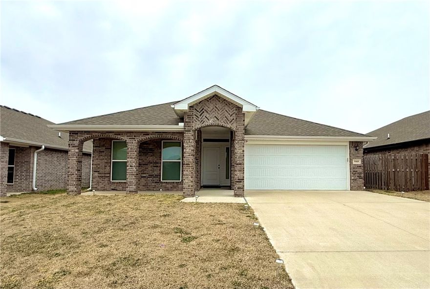 Beautiful home built in 2022 and located in the desirable Woodward Hills subdivision of Bentonville! Lawn care is provided by the owner, allowing for low-maintenance living. This well-maintained 3-bedroom, 2-bath residence offers an open-concept layout with modern finishes, a bright living area, and a functional kitchen featuring quartz countertops, stainless steel appliances, pantry, and ample cabinet space. The primary suite includes a walk-in closet and private bath. Brick exterior with great curb appeal, covered patio, and attached garage. Conveniently located just minutes from Northwest Arkansas National Airport (XNA), with easy access to Bentonville, major employers, shopping, dining, and top-rated Bentonville schools. Ideal for those seeking comfort, convenience, and a great location!