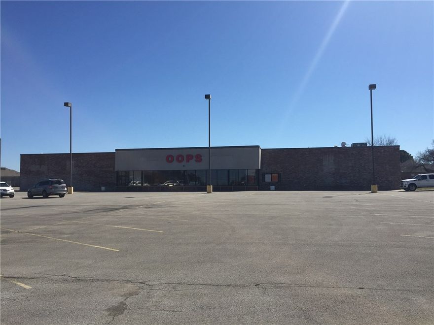 This building housed a former grocery store and then a close out store named Oops.  This property is well located on main Street.  The lot is oversized.  Retail, institutional, church or office uses possible