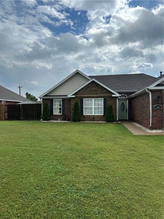 Beautiful home with increcidble back yard and extended covered back patio, 3 storage buildings, updated primary bathroom and hall bathm high ceiling in living room, extended concrete pad to backyard from front of home.