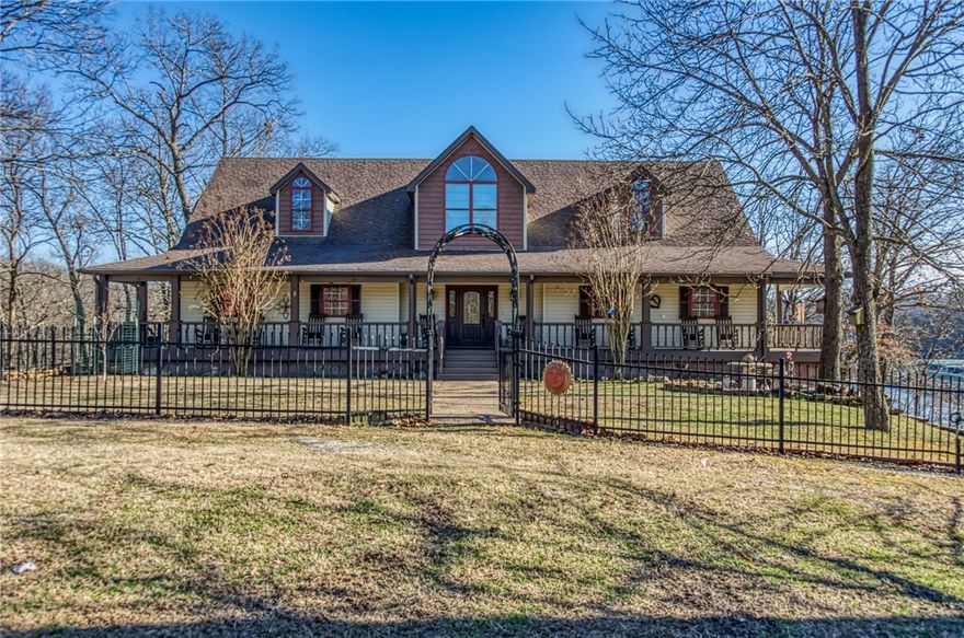 2.5 acres centered in a 10 acre cove peninsula. Lakeviews from 4 sides. 2 boat slips with lifts in a 3 family dock. 17ftx40ft saltwater pool. Big front yard with 2 swings arbor. 40x60 workshop w/1/2 bath. & RV hook up. Heartpine flooring. 6panel oak doors, antique marble door knob sets. Real beams. Delux trim-baseboards, door facings, crown molding, wainscoting. Cedar closets. Upstairs-4 lg. bedrooms with walkin closets,3 full baths. 1-2 person jacussi, 3 electric fireplaces. Master has balcony. Ceiling fans. 1 playloft. Top of stairs sitting balcony. Large maids closet. Downstairs- big laundry room double washer/dryer hookups. Maids closet & storage. Granite counters. Kitchen- granite counter with large island sitting bar, farm sink, large pantry storage and china cabinet. Two refrigerators, flagstone floor kitchen and foyer. Large diningroom, Livingroom stone gas fireplace. Knotty pine walls, beam ceiling. 3 baths. Sunroom and in-law quarters. Ask agent for complete attributes page. NEW ROOF APRIL 2020