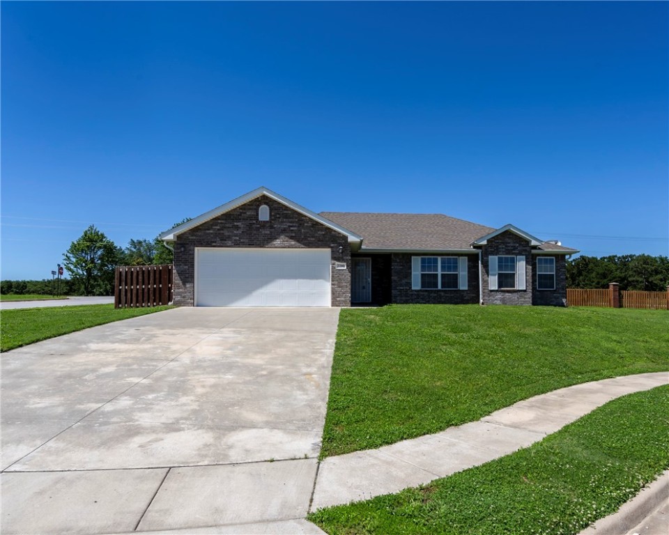 Move in ready! Your new home is here waiting for you! Professionally repainted interior! Built in 2019. 3 bedrooms, 2 baths, 1483sf, open floor plan, all brick home with a covered back patio. Granite countertops, a new microwave, and a corner pantry in the eat-in kitchen. Washer, Dryer, and Refrigerator all convey. Tile in the wet areas and newly placed carpet elsewhere. Split bedrooms. Seller installed new electrical switches, receptacles, vent registers & lighting! Privacy fenced yard and corner lot located in a cul-de-sac. Easy access to Hwy 59 and Hwy 12 to go to Siloam Springs or Rogers/Bentonville areas. 25 minutes to Bentonville!