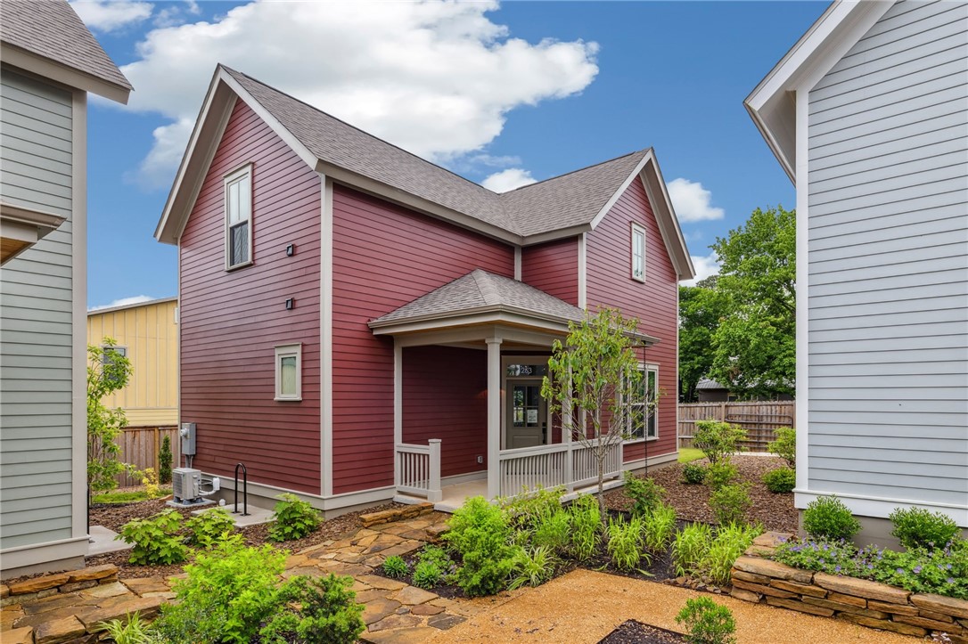 Welcome to the 11th Street Cottages; a new community centered around expertly designed private gardens. Two blocks east of the Greenway Trail, the Cottages are walkable and bikeable to the most sought-after restaurants, shops, neighborhood parks, and art centers in downtown Fayetteville. This floor plan has a spacious living room and open-concept kitchen with generous prep space and bar stool seating at the island. Designed with primary suites and laundry room connections both upstairs and downstairs, the large rooms are complimented by generous walk-in closets and spacious baths. Finished with high-end cabinetry, fixtures, lighting, and ENERGY STAR(r) high performance certified systems for maximum efficiency, comfort & healthy indoor air quality. Enjoy your own private courtyard, or join friends and neighbors on the front porch overlooking the community garden. Each unit also has dedicated parking.