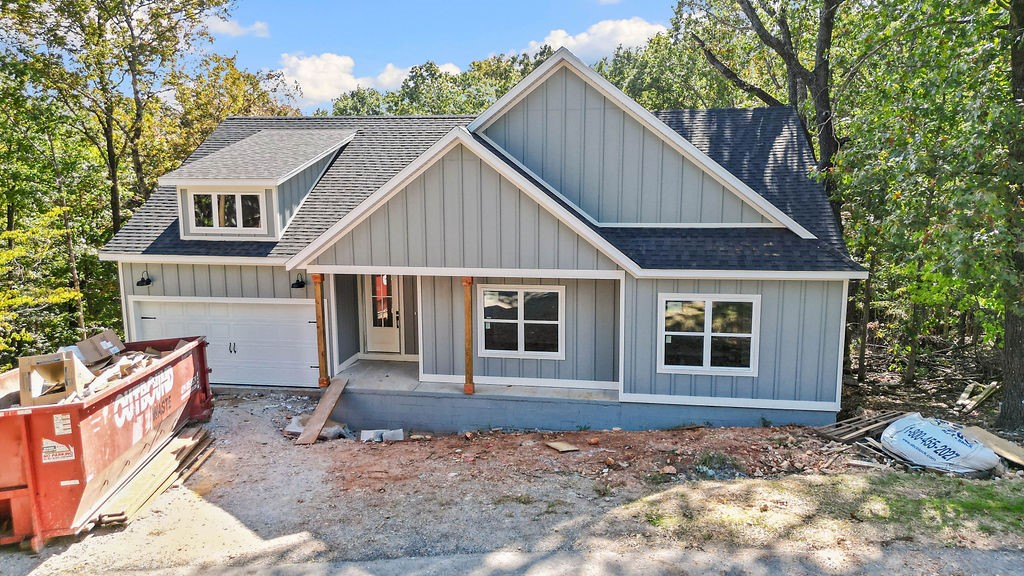 This stunning home showcases 7" hand-scraped engineered wood floors throughoutāincluding closetsāand stylish tile in the laundry and baths. The inviting living area features an electric fireplace accented with shiplap for a modern, cozy touch. Enjoy the efficiency of Low-E double-paned windows and the elegance of custom cabinets topped with 3 cm Black Pearl granite throughout. The kitchen is a true highlight, featuring stainless steel appliances and sleek finishes. Black hardware adds a cohesive, modern look across the home. Step outside to a spacious back deck overlooking a gorgeous viewāthe perfect spot to relax or entertain. Complete with a 2-car garage, this home blends quality, comfort, and beautiful design in one perfect package!