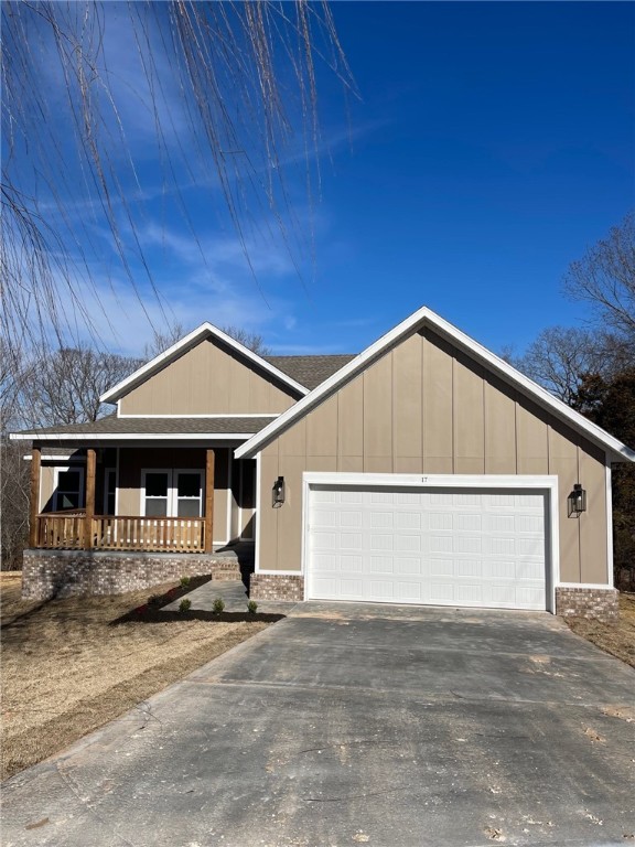 Make this brand new beautiful Bella Vista home yours today. This 3 bedroom 2 bath home sits on oversized lot .37 acres with office/flex room (has closet) on a quiet cul de sac in East Bella Vista, Bentonville Schools, and close proximity to Pea Ridge. You will be welcomed by a brick with batt & board siding & cedar posts to accent the home perfectly. Split plan with open concept, spacious kitchen, custom cabinetry, island, white tiled backsplash, huge pantry across from utility room, OTR microwave with vent. The master suite features a tiled glass door shower, spa-like soaking tub, two closets, & double vanity. Wood flooring in main areas & office, carpet in bedrooms, and for the nature lovers...enjoy the outdoors with a covered front porch & covered deck out back has outstanding wooded views. Roll out the garage onto The Ledges trail off the back property line and short distance West to the Back 40 trail. Near Metfield pool, clubhouse/golf course, rec center, and a few of the pristine lakes.