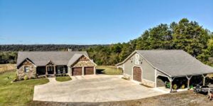 Drive in to your own peaceful paradise just minutes from town situated on approx 10+/- acres of private property! Step into excellence as you enter through your private gate and step into this 3 year old home. From the hand planed floors to reclaimed beams you will fall in love with all the details here. Enjoy your views of all the wildlife from your living area or sit out on the screened porch or open deck area complete with hot tub to relax in. Inside features amenities like hand planed flooring, reclaimed wood beams, jennair appliances, back up generator and tankless water heater. Large butlers pantry doubles as a safe room with concreter walls and ceiling. Outside shop features man cave/apt complete with full bath and cent ht/air. Shop features 14' roll up door and two carports!