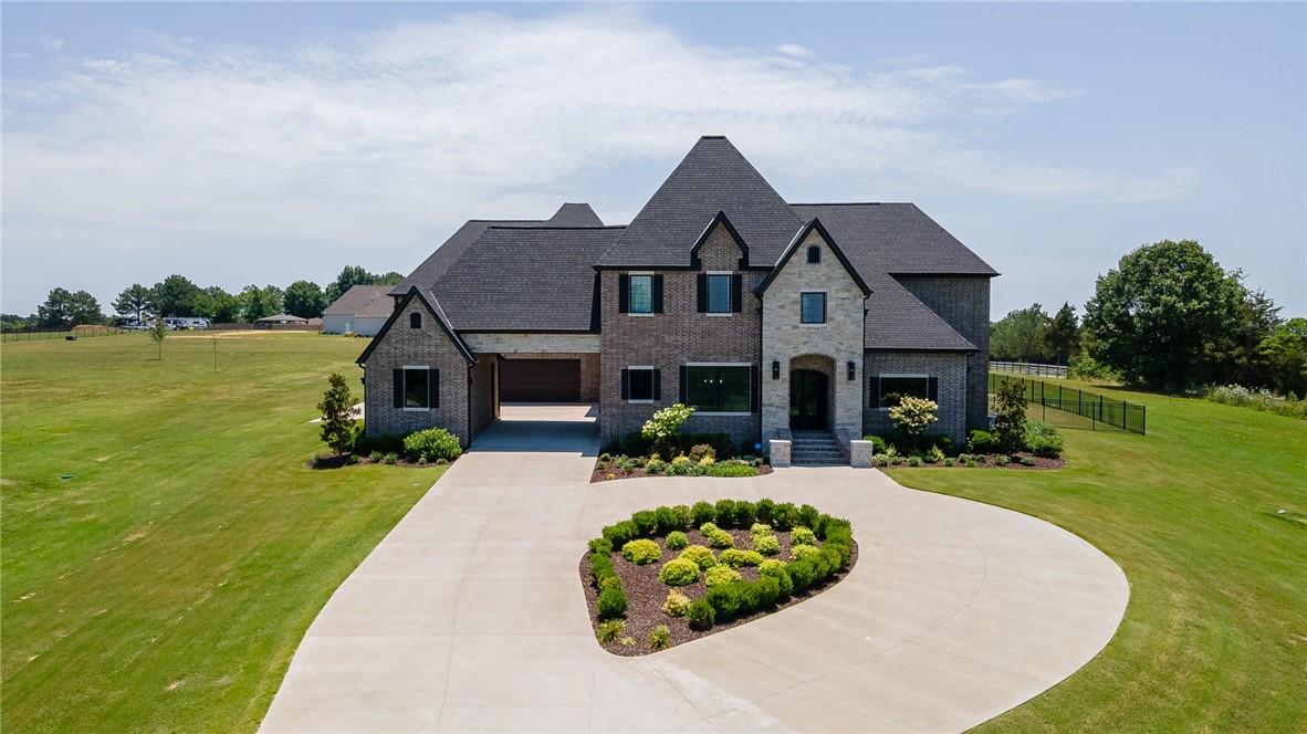 Gorgeous East Fayetteville custom estate property situated on 5 acres with a natural pond! This home offers 6,376 heated and cooled sq ft, 5 bedrooms, 4 full baths, 2 half baths, amazing eat in kitchen open to living, study, formal dining, enclosed sunroom, media room, craft room, mudd room, and laundry room. Amenities include 9ā white oak wood floors, built in professional grade appliances, walk in pantry, drop station, Pella wood casement windows, 8ā doors, in-ground diving pool, outdoor fire pit, wrought iron fencing, safe room in primary closet, 100ā media room screen, 4 car garage with Portico, and tons of walk in storage. Zoned for Vandergriff Elementary and Woodland Junior High. The attention to detail in this house is amazing!!!