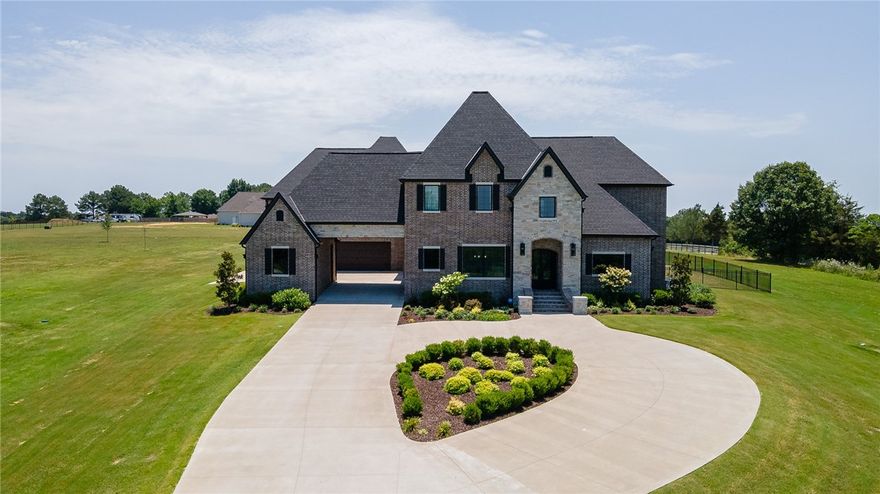 Gorgeous East Fayetteville custom estate property situated on 5 acres with a natural pond! This home offers 6,376 heated and cooled sq ft, 5 bedrooms, 4 full baths, 2 half baths, amazing eat in kitchen open to living, study, formal dining, enclosed sunroom, media room, craft room, mudd room, and laundry room.  Amenities include 9” white oak wood floors, built in professional grade appliances, walk in pantry, drop station, Pella wood casement windows, 8’ doors, in-ground diving pool, outdoor fire pit, wrought iron fencing, safe room in primary closet, 100” media room screen, 4 car garage with Portico, and tons of walk in storage. Zoned for Vandergriff Elementary and Woodland Junior High. The attention to detail in this house is amazing!!!