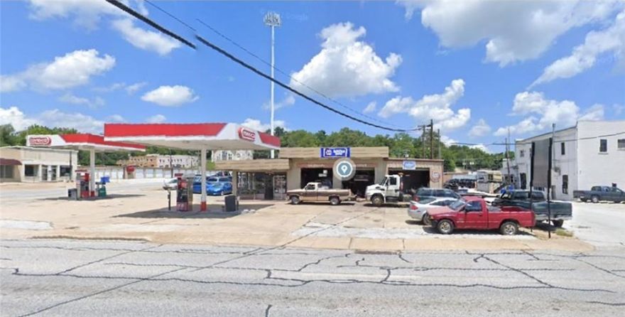 Prime corner lot located directly across from the Brandon Burlsworth Youth Center and just minutes from the newly constructed Creekside Community Center. This versatile property was operating as an automobile service station, auto repair shop, and towing business. A secure, chain-link fenced area is already in place, and the on-site fuel tanks have been removed. With its excellent location and existing infrastructure, this property offers a strong foundation for a variety of business opportunities—bring your vision and make it your own.