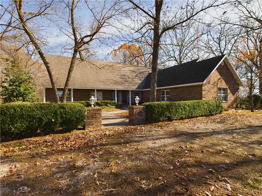 Look at this gorgeous Waterfront Country Estate! Located between Branson, Missouri and Harrison, Arkansas; also near Table Rock Lake and the Buffalo River National Park. This executive style 5 bedroom, 3 1/2 bath brick home sits on approximately 45 acres and has features galore! Spacious kitchen with newer appliances and pantry, living room which opens out onto large glass enclosed porch or sunroom, den with gas log fireplace, formal dining room and office. Large area upstairs can be 5th bedroom or rec room. 3 car garage. Horse barn. Year round Bear Creek frontage! Pasture. Woods. ATV trails. Private quiet setting, yet only 4 miles to town!