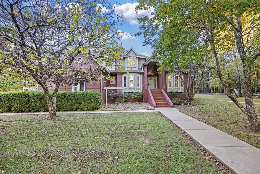 4 BEDROOMS • DETACHED SHOP • IN-GROUND POOL — CLIFF & STREAM
Located in one of Russellville’s most desirable neighborhoods within the Pottsville School District, this immaculately maintained 4-bedroom, 3.5-bath home offers over 3,100 sq. ft. of refined living and quality craftsmanship around every corner. The main living room features floor-to-ceiling windows that fill the space with natural light and create a grand, welcoming feel. The hearth room with built-ins offers a cozy retreat connected to the kitchen and breakfast nook, where a kitchen window overlooks the sparkling pool. The kitchen includes granite countertops and timeless finishes. Step outside to your private paradise with an in-ground pool, pool house with kitchenette and bath, and a detached shop perfect for hobbies or a man cave. With tons of storage throughout this home, a attached three-car garage, and move-in ready perfection, this home delivers elegance, comfort, and location all in one.