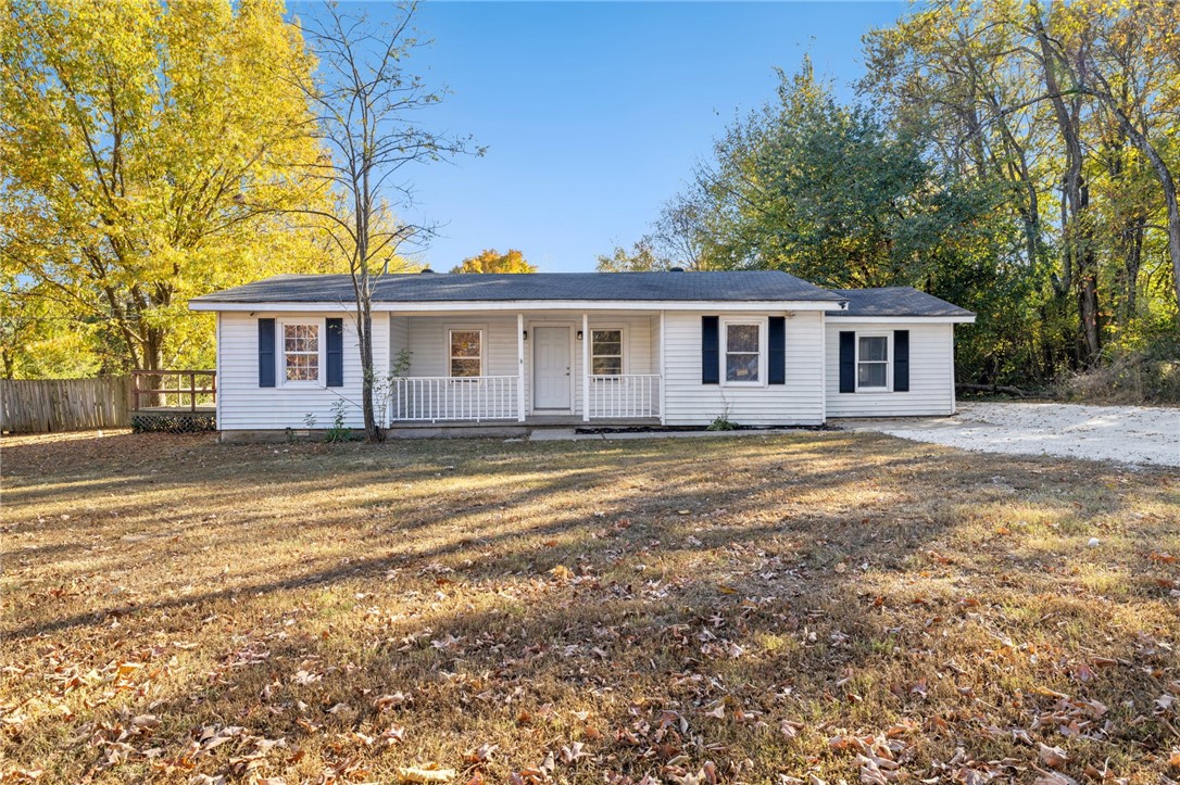 Discover a unique opportunity to own nearly an acre just off I-49 and directly across from Centennial Bike Park at Millsap Mountain! This property includes a 3-bedroom, 1-bath home with multiple outbuildings—a 35x22 garage/workshop and a 30x20 cinderblock building—ideal for storage, hobbies, or additional use.
The location has endless opportunity: surrounded by hotels, restaurants, multi-family housing, and recreational amenities, with over 228± acres of state-of-the-art trails just steps away. The home is currently zoned R/O, making it perfect for a home based business needing workshop or storage space. With all new LVP flooring, recently renovated bathroom, and fresh paint, this home is move-in readymade while you come finish making it your own. Whether you’re looking for a residence in the heart of Fayetteville’s growing recreation district or a property with long-term development upside, this one is a rare find. The home is currently rented, so please do not disturb current tenants. Agent Owned.