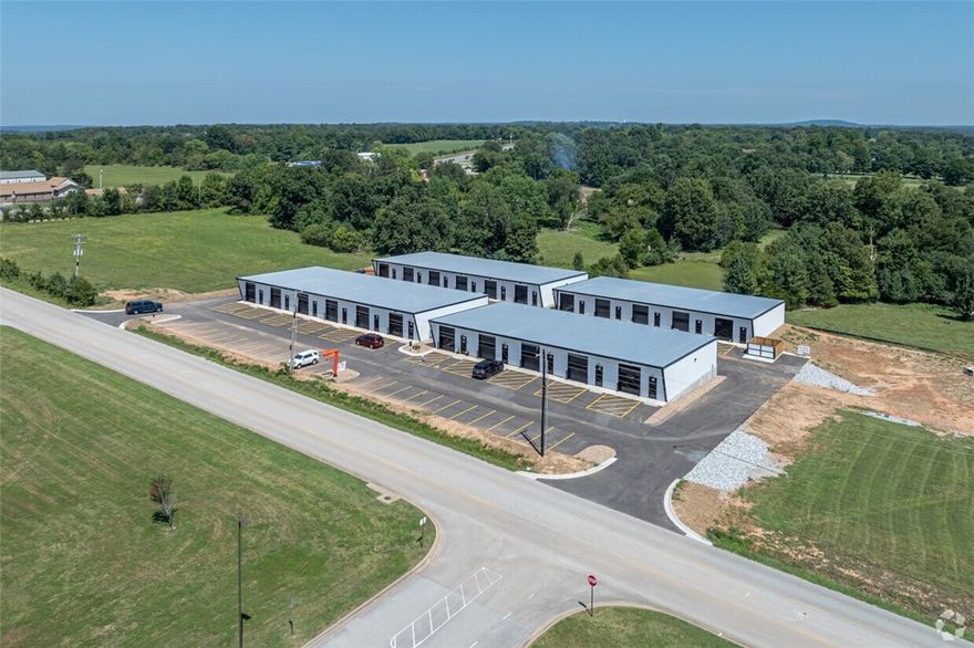 Small Bay Solutions: Your Gateway to Business Success! Experience a connected community where small businesses thrive. Located opposite Sonora Elementary & Middle Schools, our units offer more than just space – enjoy networking opportunities, advertising campaigns, social media support, small business support. With several move in ready models to choose from and build to suit we have what you are looking for. All units have the following individual amenities including HVAC, private bathrooms, storefront & garage doors. Starting at 1500 sq ft with opportunities for combining units for more space. The additional small business services are included in your lease amount, no extra cost! Go to SmallBaySolutions.com to find out about this new concept coming to NWA today. We are like no other flex space in the nation! Ask us about our office suite if you need a smaller space. Need a location for your franchise we are an excellent and affordable option? NOW OPEN! Call to schedule a showing today.