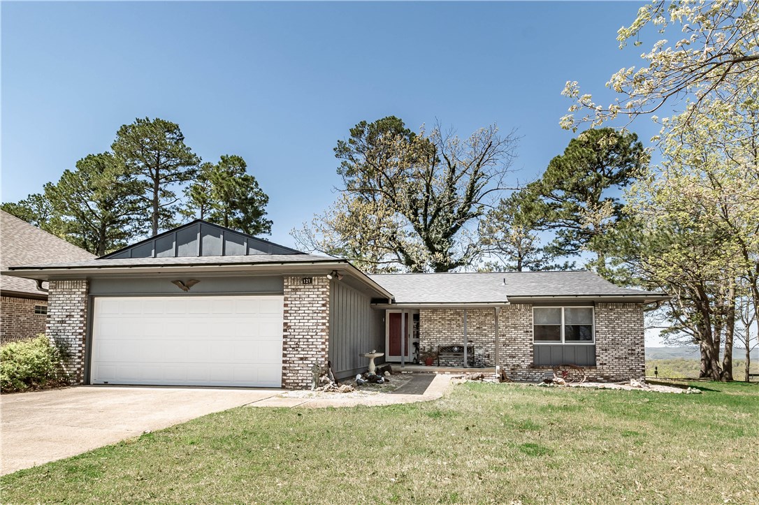 Lovely split floorplan, all electric, Ranch-style home on the Golf Course with spectacular long-distance view of the Ozark Mountains! 3 bedrooms, 2 full bathrooms. New architectural shingle roof March 2019. New since June of 2018 : 2 toilets, stove, garbage disposal and paint in the living room and kitchen. Unique gas-log fireplace in living room and fantastic open deck and screened porch in back for your outdoor enjoyment and the location is convenient to all Holiday Island has to offer.