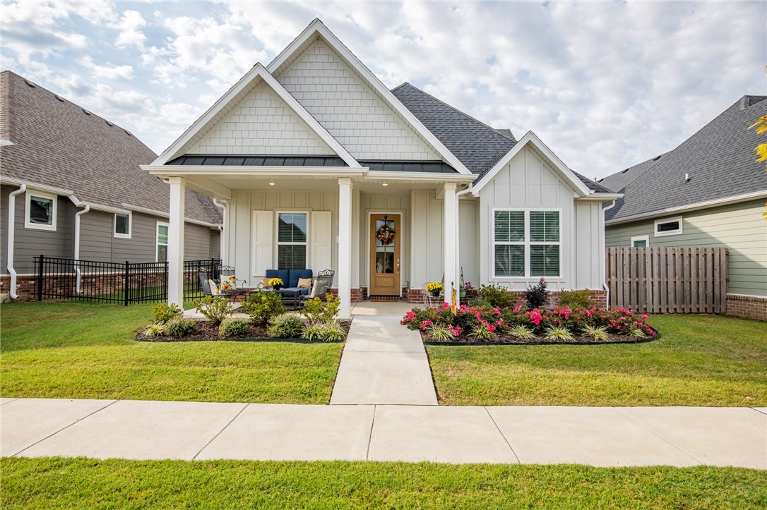 Beautifully maintained 4-bedroom, 3-bath home in Cottages at the Park! Built by Landmarc Custom Homes, this open-concept floor plan offers 2 bedrooms downstairs, including the primary suite with spa bath, and 2 bedrooms upstairs with a shared bath and double vanity. The kitchen features custom cabinetry, walk-in pantry, tons of storage, and lots of natural light. Additional features include engineered hardwood floors, mud bench/drop zone, separate utility room, freestanding soaker tub, and a fully insulated 2-car garage. Covered patio with gas hookup and wired for TV is a great space for outdoor living. POA covered lawn care allows you to enjoy neighborhood amenities like the community pool/clubhouse and take advantage of direct access to 120-acre Shaw Family Park with walking/biking trails, playgrounds, splash pad, dog park, tennis courts, ball fields, and fishing ponds. This home is move-in ready — schedule your showing today!