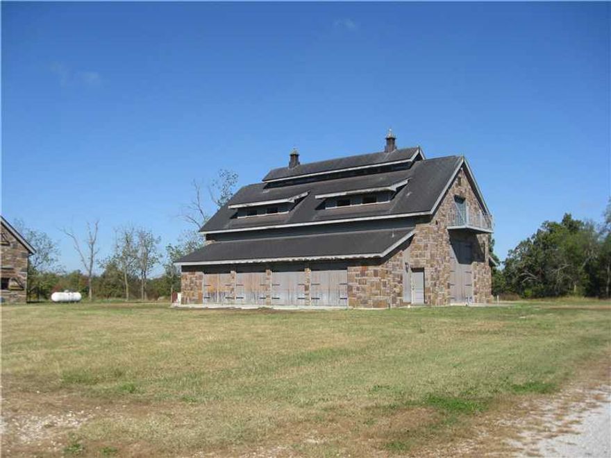 Outstanding 86 AC close in. Beautiful views. 2 older homes, 3 newer rock buildings w/living quarters up stairs. Lots of garage doors & storage below. Very unique place. Foundation in place for large home. Local bank foreclosure, quick answers. Beautiful,building sites. Lots of pipe fence, open fields, woods & road frontage. Very private but close in. You really have to see this property to appreciate it!