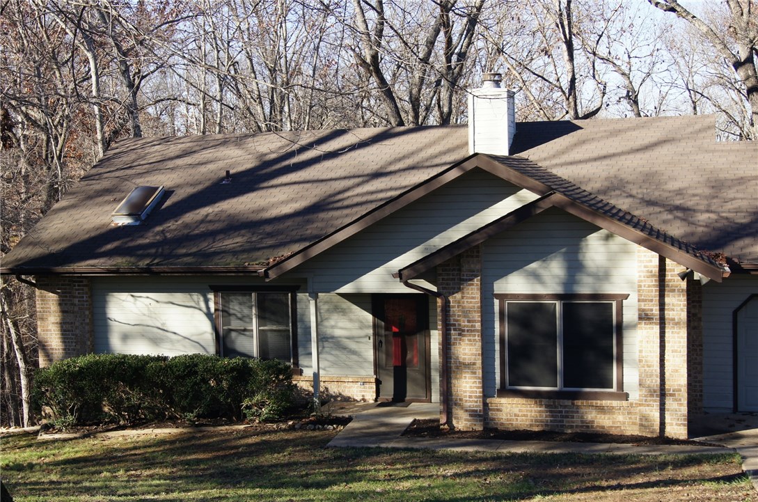 Solid 2 bedroom 2 bath house located in Bella Vista. This house has a fireplace, large living area, big bedrooms, detached storage building, and much more. Great value at under $100,000