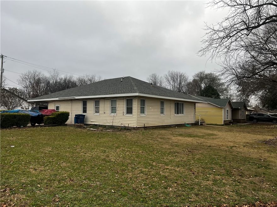 5-Bedroom 2-Full Bath home in the heart of Siloam Springs. Corner lot with 2000+ sq ft of living space! 
Roof in like new condition, car-port, gas stove, and storage buildings. Tons of potential! Possible commercial, next to business district.