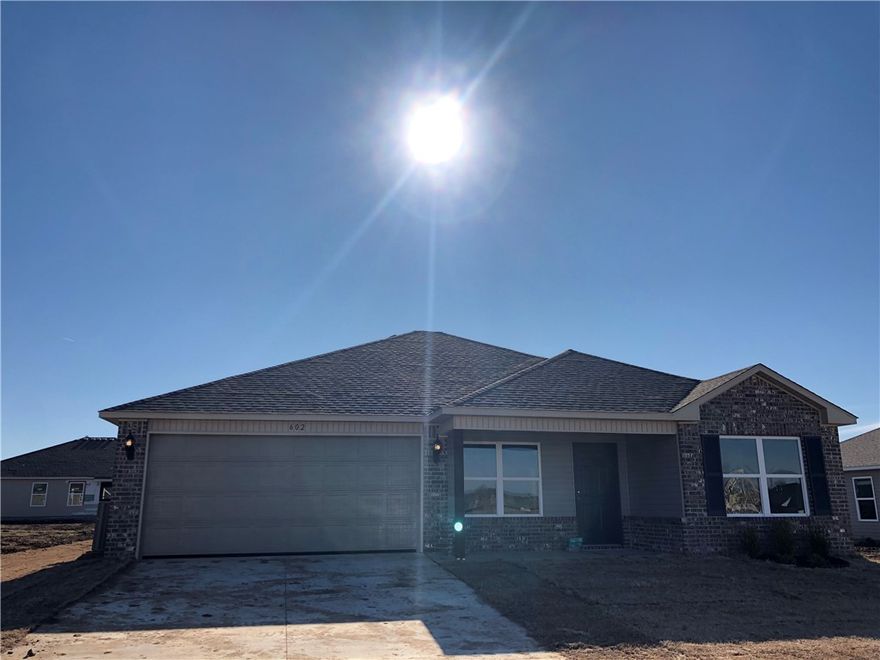 Newer construction 4 bedroom 2 bath, wood floors, great room with breakfast bar, eat-in kitchen, all appliances, almost 1500sf, neutral colors, large master suite and master bath, 2 car garage, large backyard.