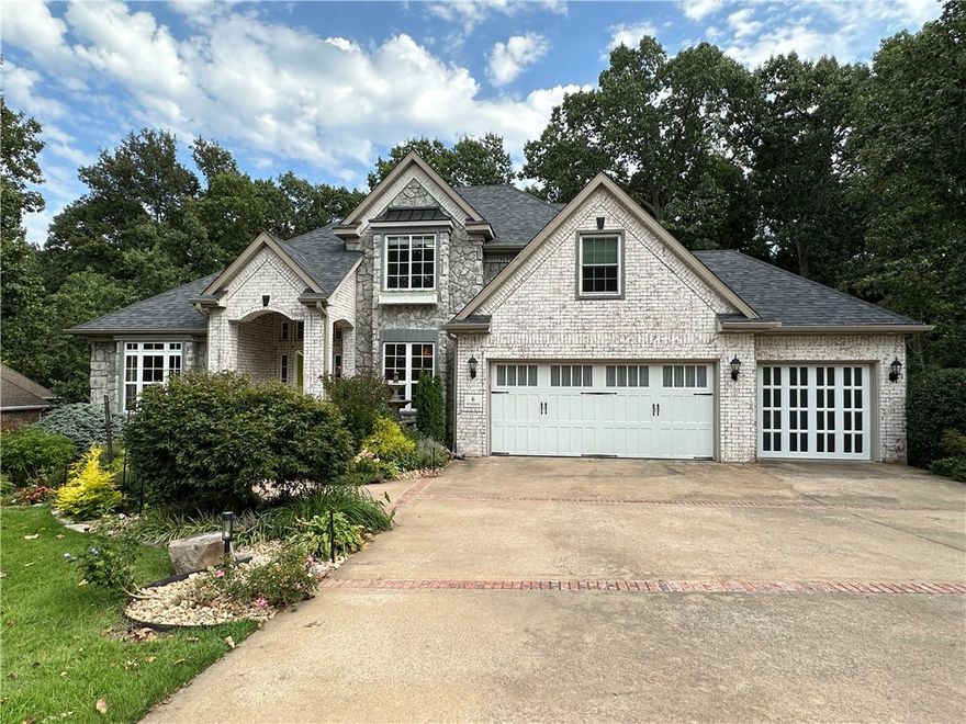 Nestled in the coveted Stonehenge subdivision, this residence offers the epitome of North Bentonville living. A wooded backdrop and meticulously manicured landscaping provide a serene setting for this recently remodeled home. With outstanding curb appeal, this home will make you fall in love as soon as you pull up. Spread across three levels, this property boasts 3 living areas, office, dining, 6 bedrooms, and 3 & 1/2 baths. The primary suite on the main level is a haven to ensure privacy. You will love the shiplap fireplace in the hearth living room. Step outside to a generous deck, perfect for entertaining and enjoying the serene view. For fitness lovers, there is trail access at the front of the subdivision. This residence is move-in ready, promising a seamless transition for you. We invite you to explore this remarkable property in person. Experience the extraordinary lifestyle it offers and make your dream home a reality. Don't want to wait- click on the virtual tour to explore the home from your computer now!