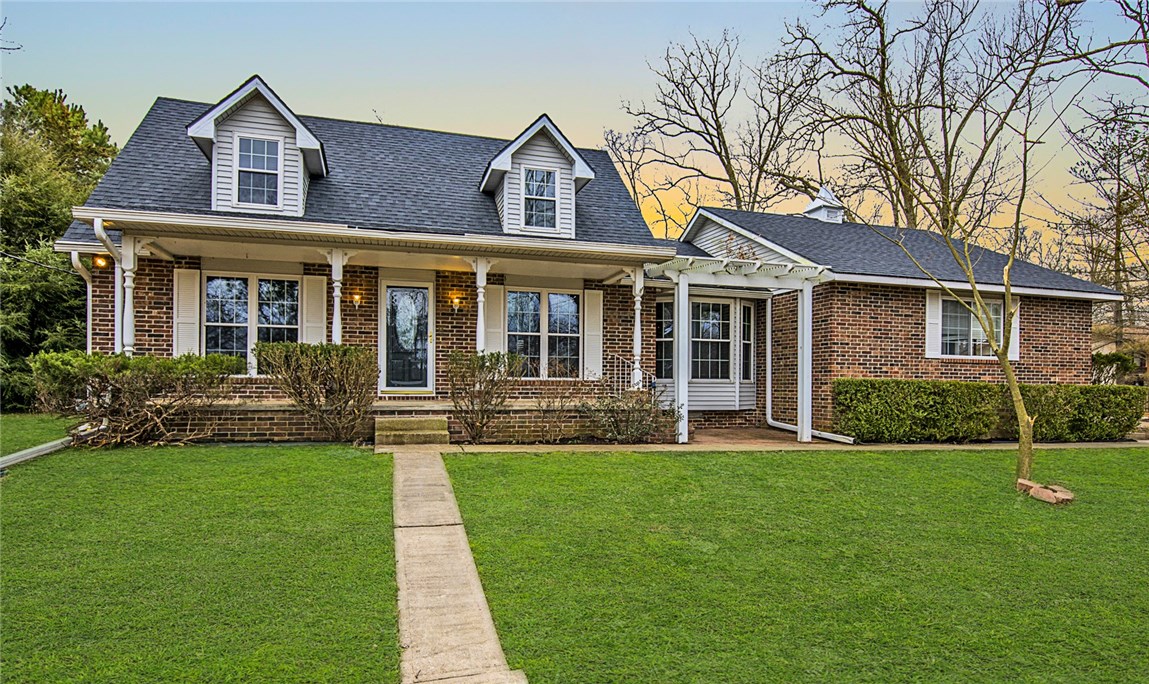 Come check out this Charming 2 story home in the Prairie Creek area of Rogers. Inside you'll find a large living space with wood floors and warmed by a wood stove. Separate updated kitchen/dining area features new granite countertops and new Stainless Steel appliances. Master bedroom is downstairs with spare bedrooms on the 2nd level. Other features include sunroom, covered deck and covered front porch. New roof in 2020. Also don't miss the 16x20 detached workshop.
