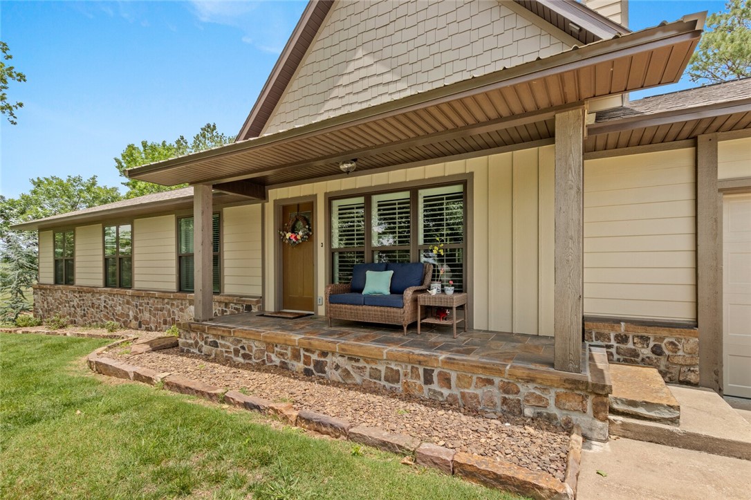 Privacy Galore!! 1.13 Acres. Completely Remodeled down to studs in 2018 by Builder. This 2657 home has custom wood flooring throughout, large open kitchen with island, granite, bar seating, stainless steel appliances. Family room with exposed beams and cozy wood stove. Living room with amazing rock fireplace with gas logs. Huge hidden walk-in pantry would meet any persons dreams. Huge master suite with Master en suite w whirlpool tub, and tiled walk-in shower, large WIC. 3 bedrooms and 2 baths on main floor, large bonus room with bath on second level. Enjoy the out door fire-pit, a covered patio, porch and Amazing out door space with abundant Natural surrounding of trees, wild life and more. Bentonville Schools, Evening Star Elementary and short distance is Mobius after school and explore amazing things!