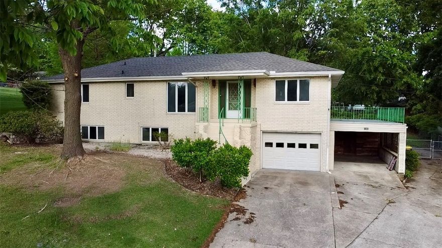Newly Update! Brick exterior, 1 car attached garage, 1 car attached carport, with chain link fenced back yard, with concrete drive to the back door.  New light fixtures, luxury vinyl plank flooring through out the home, New appliances, New Bob Parkhill Cabinets in the kitchen & bathrooms, new granite counter tops, covered front & back porch and deck.  Main level features spacious living room with fireplace, kitchen & dining area, 2 bedrooms, 1 full bathroom, with study office.  Basement features: bedroom, full bathroom, family room, workshop area and 1 car garage.
