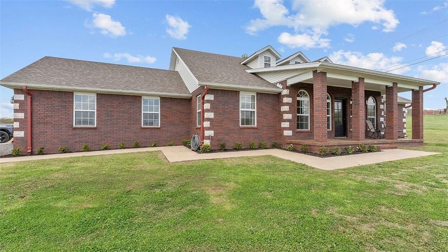 Custom brick home on 11.93 acres with rolling pasture, mature trees, a private stocked pond and wide open views—just minutes from town. This 3BR/3BA home features cathedral ceilings, tile floors, and a light-filled open layout. Kitchen features ample cabinetry, functional island, and new appliances. Primary suite includes updated bath with soaking tub and custom tile shower.

Outdoor living includes covered patio, fenced areas, above-ground pool with deck, detached workshop (electric, gas & water).

MAJOR UPDATES: (2026) New HVAC system, new appliances, fresh interior paint, siding repairs, resealed asphalt driveway, new landscaping, pressure washing throughout, sealed concrete countertops, new pool pump & filter, (2025) pressure pump, (2023) new pool liner, (2020) water heater and roof.
Additional features: propane heat, public water, septic, and generator-ready setup.

Move-in ready acreage with privacy, usability, and extensive improvements already completed.