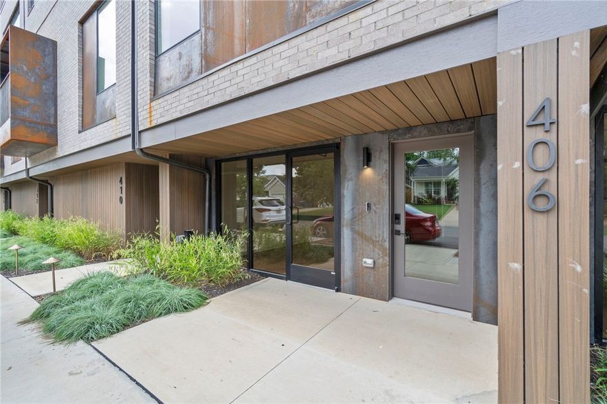 Live/work condos in downtown Bentonville offer a unique opportunity to combine your personal and professional life in one convenient space. This particular condo is located in the heart of downtown, within walking distance of popular attractions such as The Momentary, Bentonville Square, Crystal Bridges, the future Walmart Campus, and local favorite eateries. The first floor of the condo is a versatile space that can be used as a business area or a guest bedroom, with its own private entrance and full bathroom. Upstairs, the main living area boasts custom-built walnut cabinets, quartz countertops, integrated Sonos speakers, oversized windows, and wood floors. Additionally, the condo includes a primary bedroom and a flex space for added versatility. Overall, this live/work condo in downtown Bentonville offers a rare opportunity to live and work in a bustling and vibrant community, with all the amenities and attractions at your doorstep.