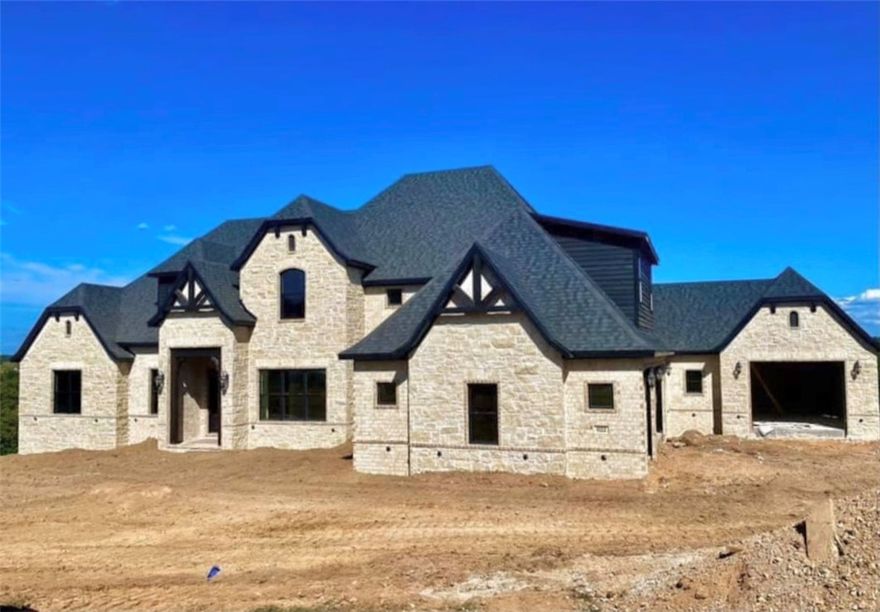 Stunning New Construction Home in the gated Beau Chalet Subdivision. This home comes with two lots giving you over 2 acres with the most amazing views from your back deck/outdoor entertainment space!  This open concept floor plan has a large living room and kitchen space, formal office/study, formal dining,  5 bedrooms, 4 full baths, 2 half baths, large media room with wet bar space, large bonus room, and plenty of garage space! It is packed with upgrades including but not limited to: irrigation system, landscaping, outdoor grill and fireplace, central vac, wiring for sound and speakers, security system, extended back deck, large windows, custom built-ins, coffered ceilings, and upgraded fixtures throughout. Don't miss the VIEW out back. This home is a must see!