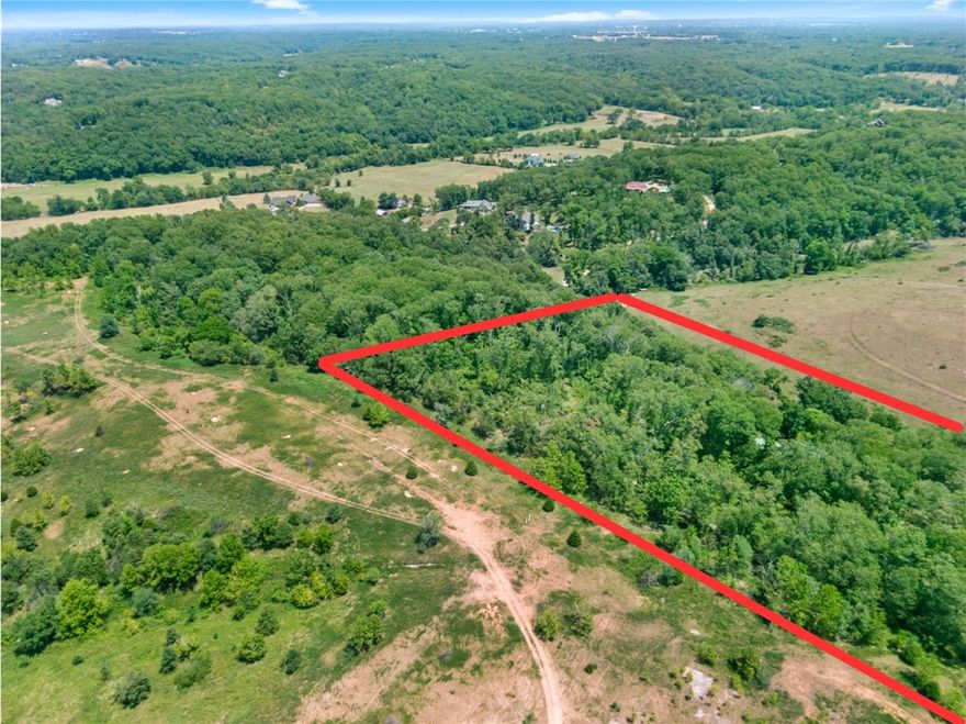 Wonderful development opportunity right next to the Slaughter Pen Mountain Bike Trails.  This rolling acreage is very near to the proposed J Street Interchange.  Bentonville continues to expand and this is in the heart of it all!  Utilities are on the property with the two houses.  However the highest value is in the land and most of all the location.  The houses are not available for showings.  Please do not disturb the occupants.