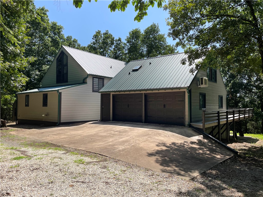 This beautiful, unique 5 bedroom house has so many opportunities for a buyer. It would be an excellent Airbnb property, private home in the woods, a get-away cabin, pad for university students, and a rental property. It has three separate living areas with exterior access that can be sectioned off from the others giving the owner many rental options. Exhibiting 22.5' cathedral ceilings in the main living room, a loft overlooking and 1100sqft wrap-around wood deck, this house is perfect for hosting company. Many upgrades including granite countertops, newer metal roof, brand new 'Hardie' permanent siding, recently tiled showers and freshly painted. Agent Owned.