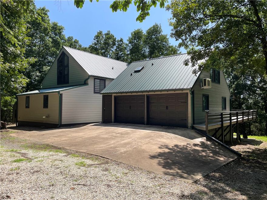 This beautiful, unique 5 bedroom house has so many opportunities for a buyer.  It would be an excellent Airbnb property, private home in the woods, a get-away cabin, pad for university students, and a rental property.  It has three separate living areas with exterior access that can be sectioned off from the others giving the owner many rental options.  Exhibiting 22.5' cathedral ceilings in the main living room, a loft overlooking and 1100sqft wrap-around wood deck, this house is perfect for hosting company. Many upgrades including granite countertops, newer metal roof, brand new 'Hardie' permanent siding, recently tiled showers and freshly painted.  Agent Owned.