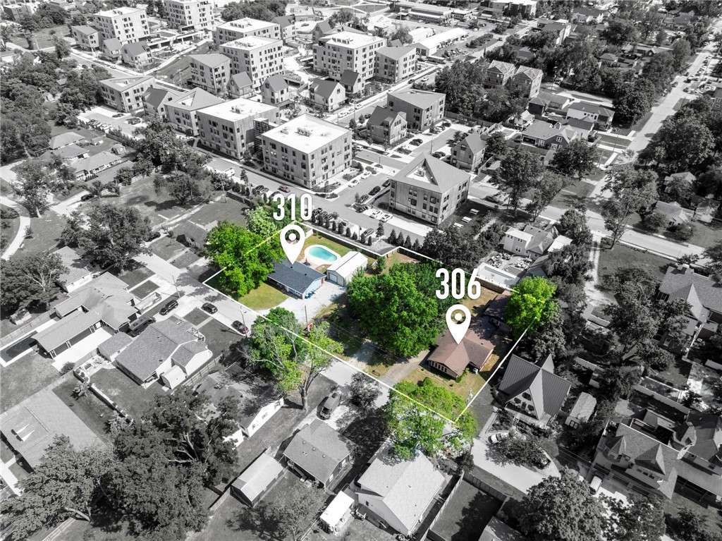 Live, Invest, Develop: Iconic Bentonville Location with Dual Homes & Development Potential!
Discover an extraordinary chance to own a piece of Downtown Bentonville's vibrant future! This unique offering presents two single-family homes on an expansive .75-acre property, all situated on an idyllic street that places you at the epicenter of the city's best. Location, location, location – it truly doesn't get better! Positioned perfectly between the dynamic Momentary art space and the charming Bentonville Square, you're steps away from world-class art, culinary experiences, shops, and cultural events and biking trails!. Benefit from immediate returns with 310 currently configured as a short-term rental. For the visionary, 306 offers immense potential with some much needed TLC Beyond the homes, the property boasts versatile amenities: two large metal shop buildings, two smaller sheds, a detached single-car garage with a dedicated office, and a refreshing in-ground pool – ideal for enjoying those Arkansas summers.