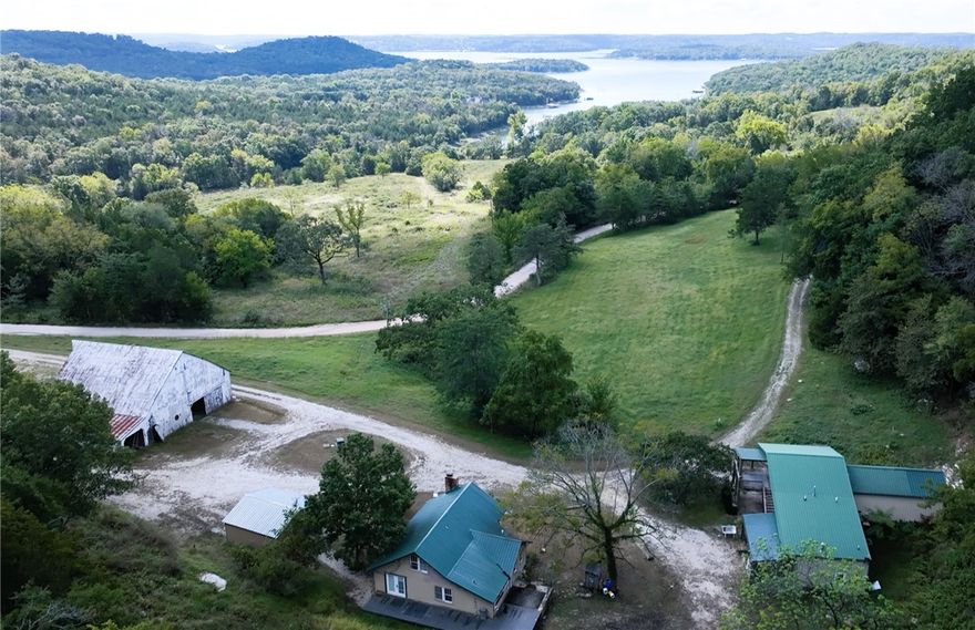 175 Acres lakefront on Beaver Lake with a private single-slip boat dock and a swim platform permitted – Endless Possibilities! Rare opportunity to own breathtaking acres with direct lake frontage on beautiful Beaver Lake. This expansive property offers the perfect blend of open land and forest—31 acres of rolling pasture complemented by 144 acres of mature timberland, ideal for recreation, hunting, or future development. The property features two residences: a charming 1,442 sq. ft. primary home and a spacious 1,920 sq. ft. guest house built in 2005, additional improvements include a 66’ x 46’ pole barn, perfect for equipment, storage, or livestock. Enjoy direct access to Beaver Lake - rare and highly desirable assets for lakefront living. Whether you envision a private retreat, hunting getaway, or a future development project, this property delivers unlimited potential. Don’t miss this extraordinary chance to own a large tract on Beaver Lake with room to build, grow, and enjoy the outdoors. See also MLS1323994