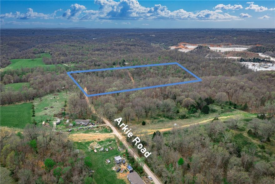 Tired of neighbors who "borrow" your stuff and never return it? Say hello to your own 19.75-acre wooded sanctuary on Arkie Rd in Rogers! This level, heavily wooded retreat is practically begging for your RV, mobile home, or dream build — and the best part? The hard work is already done. Public water and an existing on-site septic are ready and waiting, so you can literally roll in and start living. Electric is at the street, paved road access makes it easy to find, and no covenants means nobody's telling you what to do. At $295,000 with Rogers schools and taxes of just $27 a year (yes, you read that right), this is your chance to own a private slice of NW Arkansas before someone else does. Call today!