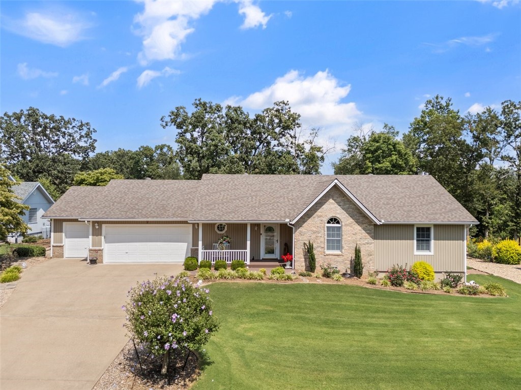 GOLF FRONT PROPERTY! Location is Key! This beautiful home is located on the 16th hole of Highlands Golf Course where location and lifestyle meet. Enjoy breathtaking views of the golf course from the sunroom or enjoy the outside on the covered deck or on the patio, where you can soak up the sun and the golf course views. Birds galore gather around the feeders in the backyard: hummingbirds, finches, bluebirds and more. Step into a warm, welcoming living room highlighted with a gas-log brick fireplace which is ideal for peaceful nights. The home features 3 bedrooms and 2 full bathrooms, a roomy kitchen and ample storage throughout. The property is professionally landscaped with numerous perennials in the front and back yards. There is also a golf cart garage. Upgrades: New roof in 2019, refrigerator in 2024, washer and dryer in 2020. All kitchen appliances and washer and dryer convey. Anderson windows throughout. Properties like this are a rare gem. Schedule your showing today - before this opportunity slips away!