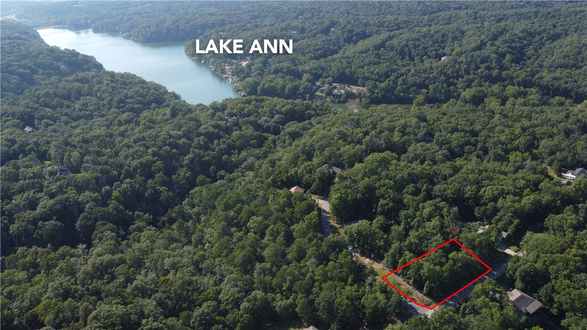 Oversized, corner lot in Berkshire subdivision. Surrounded by new development, this lot is fairly flat providing the best layout for your new home. Nestled between Lake Brittany and Lake Ann your close to all things recreation that Bella Vista offers. Bike from your front door to Summit School trail one of many connector trails to Bella Vista's world famous mountain bike trail system. Check this lot out today!