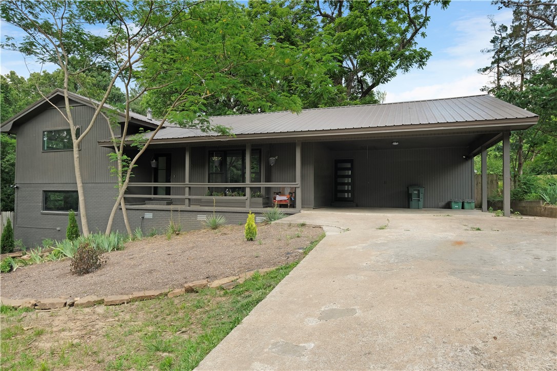 This fully remodeled split level home is in the heart of Fayetteville! This stunning home sits on a .488-acre lot, offering tons outdoor space for all your entertaining needs. Step inside and experience the beauty of this home, with a modern kitchen complete with new cabinets, stunning quartz countertops, large gas stove, all new appliances and a stylish backsplash. You'll love the new floors, adding a touch of modern elegance to this impressive home. Outside, the landscaped yard is perfect for enjoying those summer days with family and friends.Gather on the new deck and take in the scenic view surrounding area, or relax and soak up the sun on the new balcony deck. This home doesn't stop there, as both bathrooms have been fully remodeled with stunning tile walk-in showers, beautiful backsplashes, and modern raised sinks, making it a dream home. With all the modern upgrades, it is sure to check all boxes on your wishlist. Come see why this home an opportunity for those seeking luxury and comfort in a prime location.