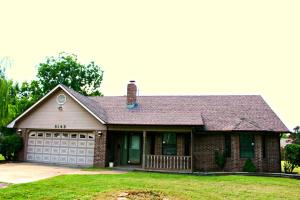 Nice spacious home with a large living room with fireplace and built-ins and a separate den. The wonderful kitchen features an island and lots of counter space and storage. Split bedroom floor plan.