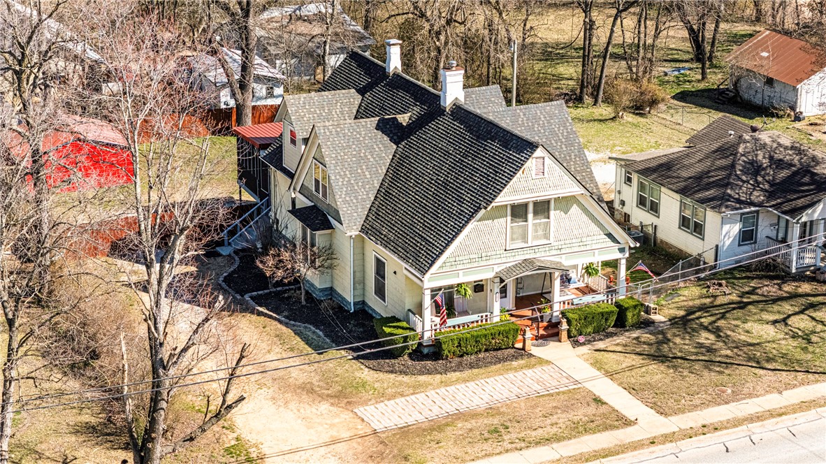 Step back in time w this beautifully preserved 1914 historical home, situated in the heart of town. Boasting 5 spacious bedrooms, 3.5 bathrooms, and 2,306 sq. ft. of living space, this gem offers character & convenience. The moment you step inside, youāll be captivated by some of the original hardwood floors, classic stained glass detailing adds a touch of artistry & charm, & soak in the luxury of vintage claw foot tubs. This home offers exceptional living and entertaining spaces, including a large screened-in back porch. Storage abounds, with a generously sized storm cellar & additional storage areas throughout the property. Practical updates, like stainless steel appliances, blend seamlessly w/ the homeās historic charm. A new 20x20 metal garage building, tucked behind the wooden privacy fence, offers secure parking and storage. Also, the roof was replaced in 2022. Home also has an additional room that is already plumbed for another half bath. Don't miss out on this rare historical find! Com Prop MLS 1301341