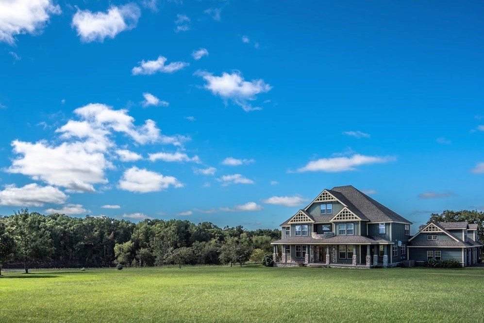 One-owner custom built 5-BR & 7-BA on 10 +/- acres w/ lots of wood floors & lodge feel w/huge stone woodburning fireplace make this home an incredible retreat. You will be amazed w/ the dream kitchen: 2 sinks, double ovens, Viking 6 burner cooktop, subzero fridge, plus beverage area & cocktail sink, large breakfast bar. This home has:5 bedrooms w/finished basement area, plus a 3rd story loft/office/6th bedroom space. There is also a mother-in-law suite/game room over garage area with full bath. The oversized garage has great workshop space & 3/4 bath w/ industrial sink. The home boasts a large front porch & tons of new deck space for entertaining. It’s easy to maintain with 2-laundry areas, central vac, & private office w/ built in shelving & file drawers. The beautiful formal dining room has built in wood & glass display shelving for an elegant touch. **Additional land can be purchased, see attachment of survey map or call listing agent for more details.